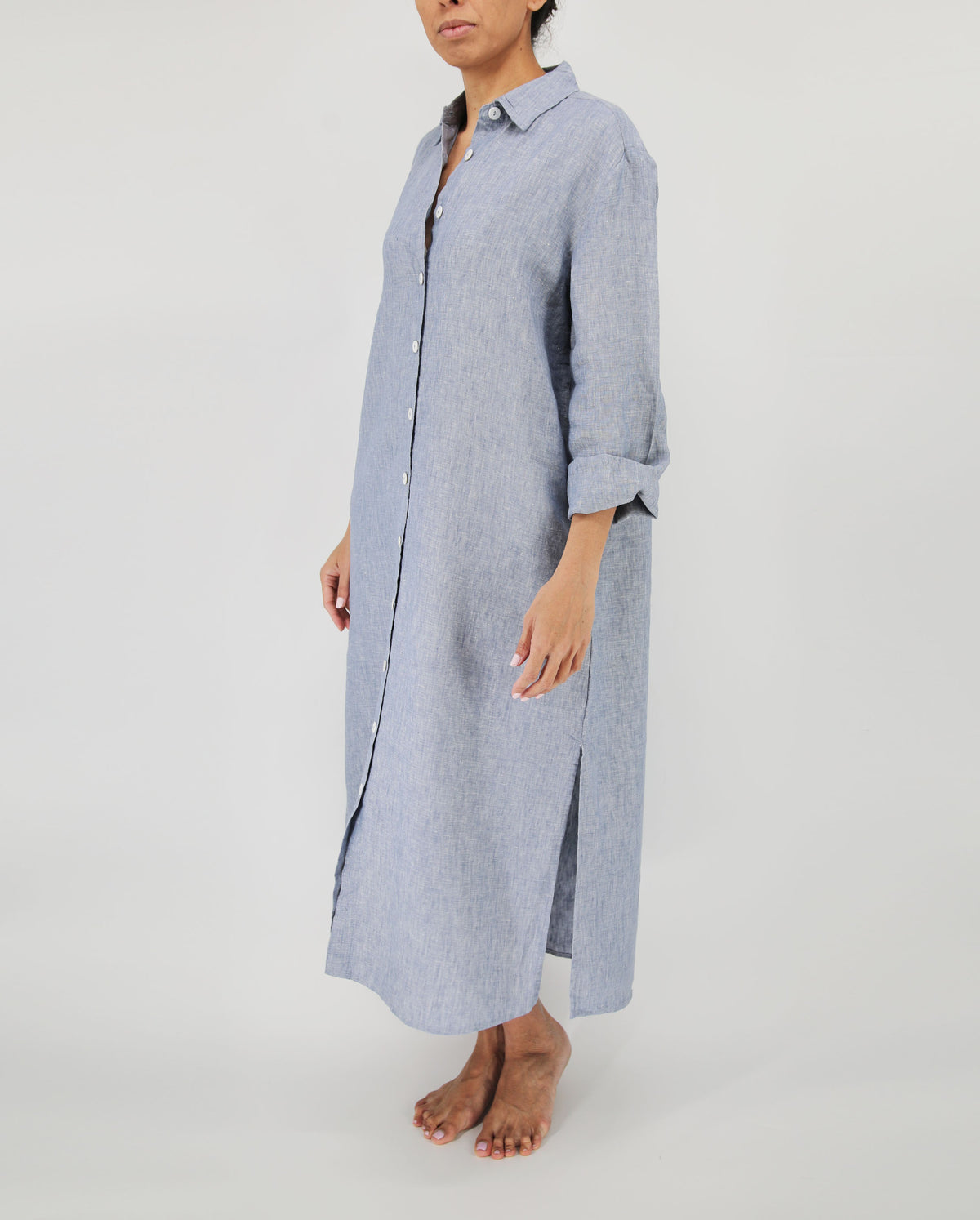 chambray light blue linen dress with mother of pearl buttons and side pockets