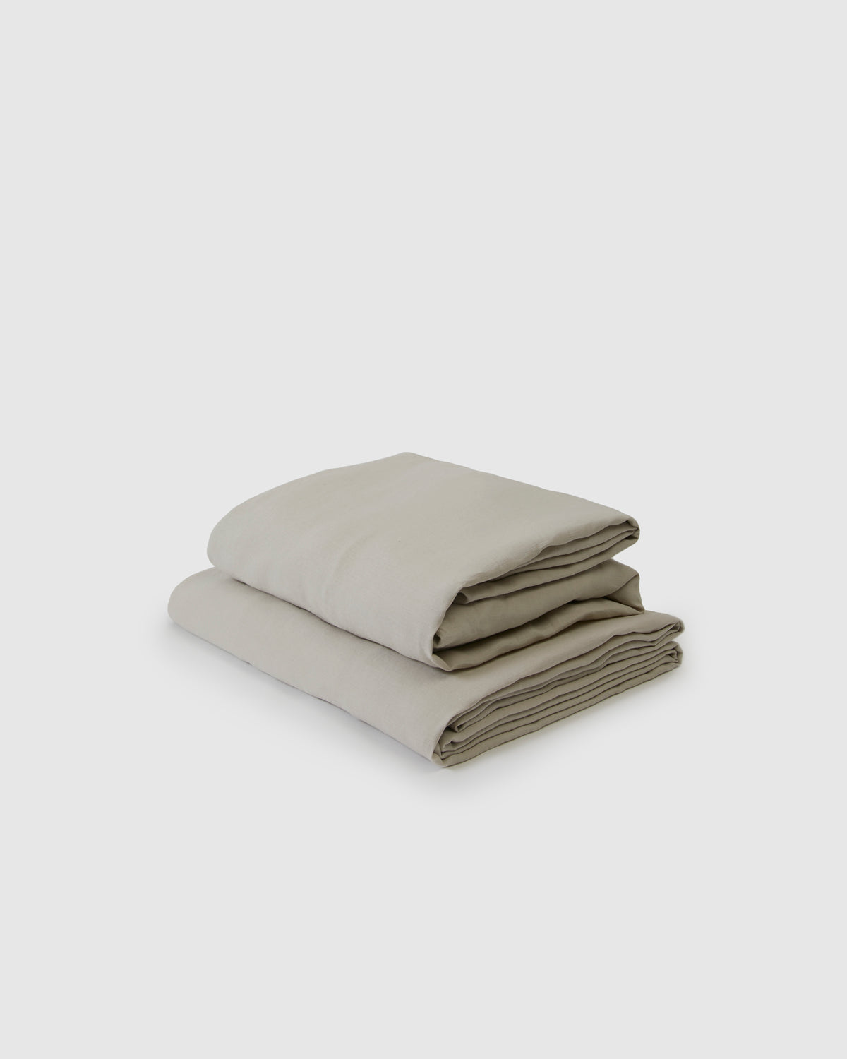 Side angle shot of light dove gray flat and fitted sheet set
