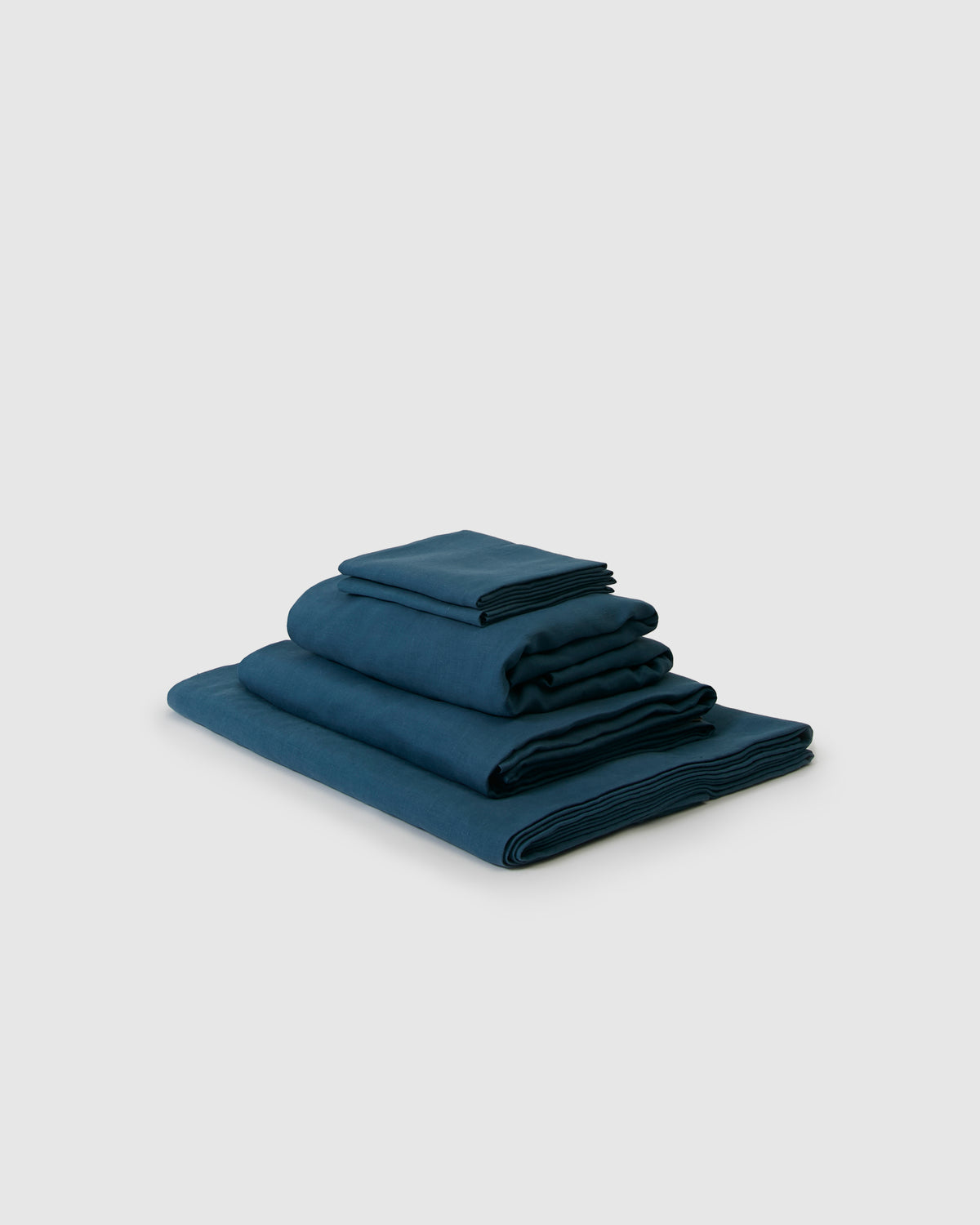 Side angle shot of a dark blue adriatic indigo sheet set