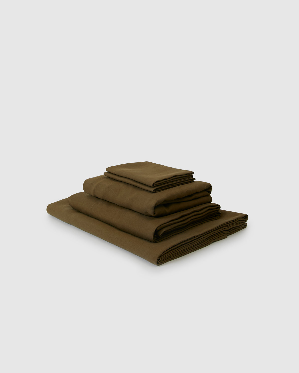 Side angle shot of a moss green sheet set