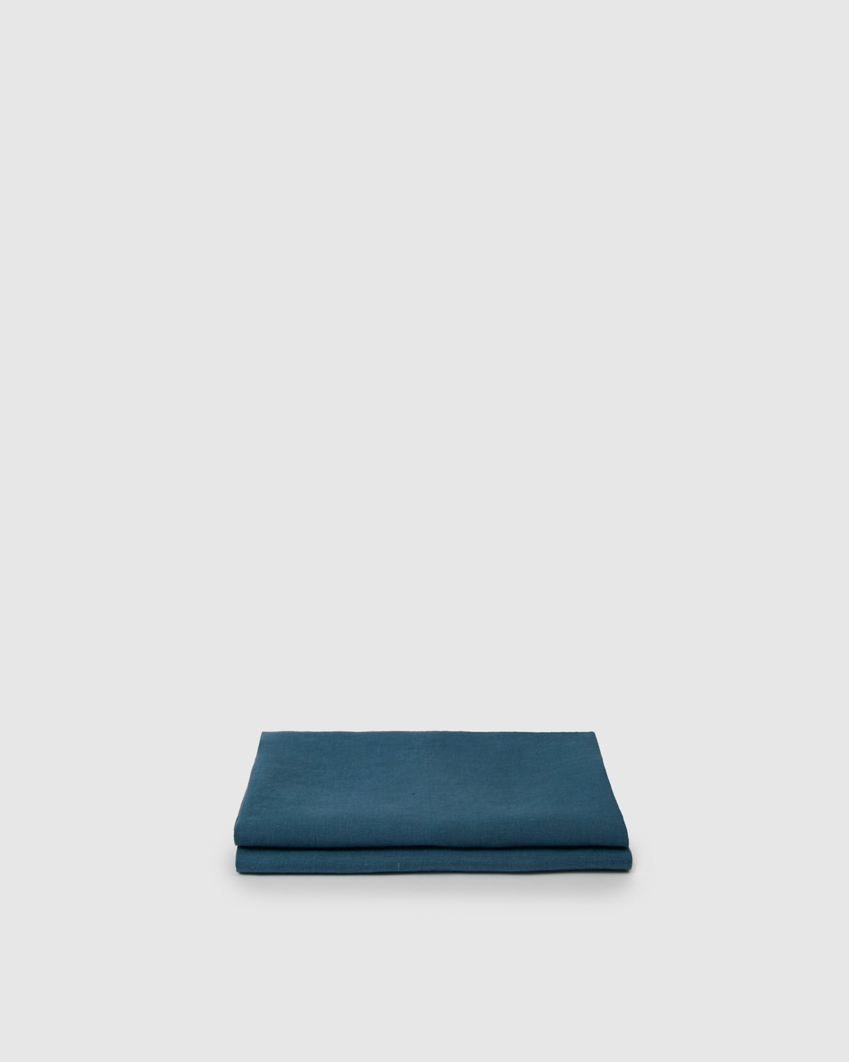 Top-folded pair of pillowcases in adriatic dark blue