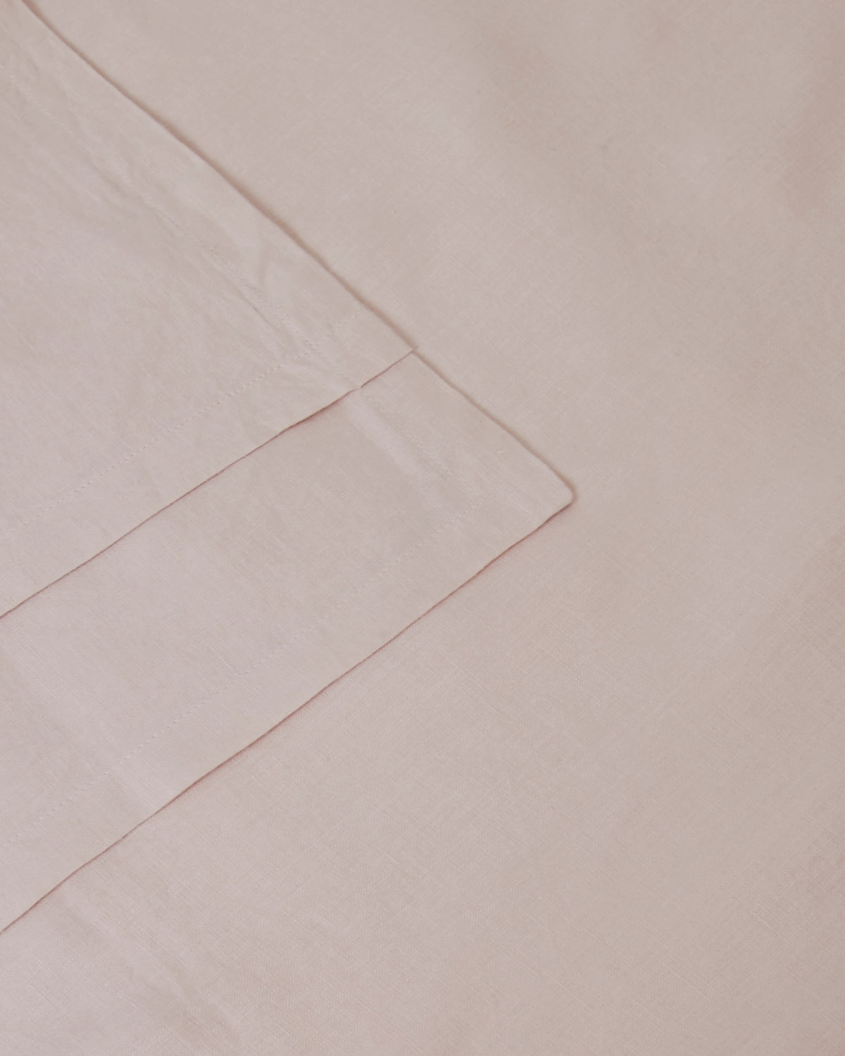Close-up of light pink blush pair of pillowcases