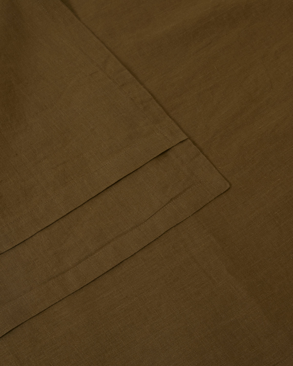 Close-up of moss green pair of pillowcases