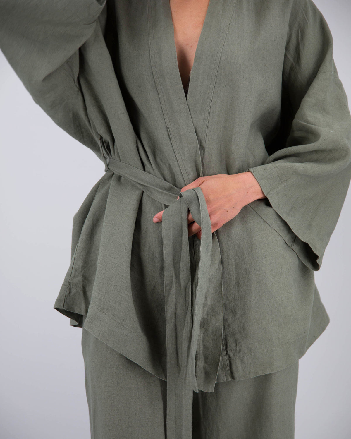 Close up of Kimono style loungwear set (top and pants) on model in khaki green