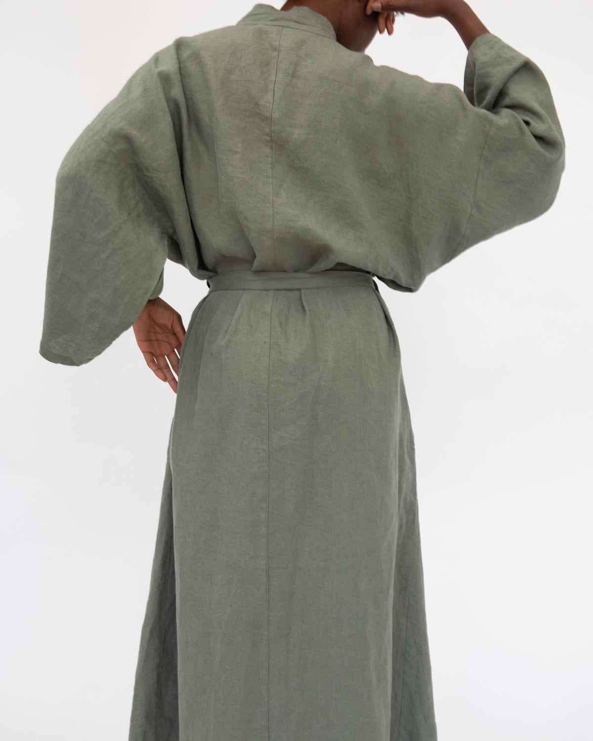 Back of full-length linen robe in Khaki green on model