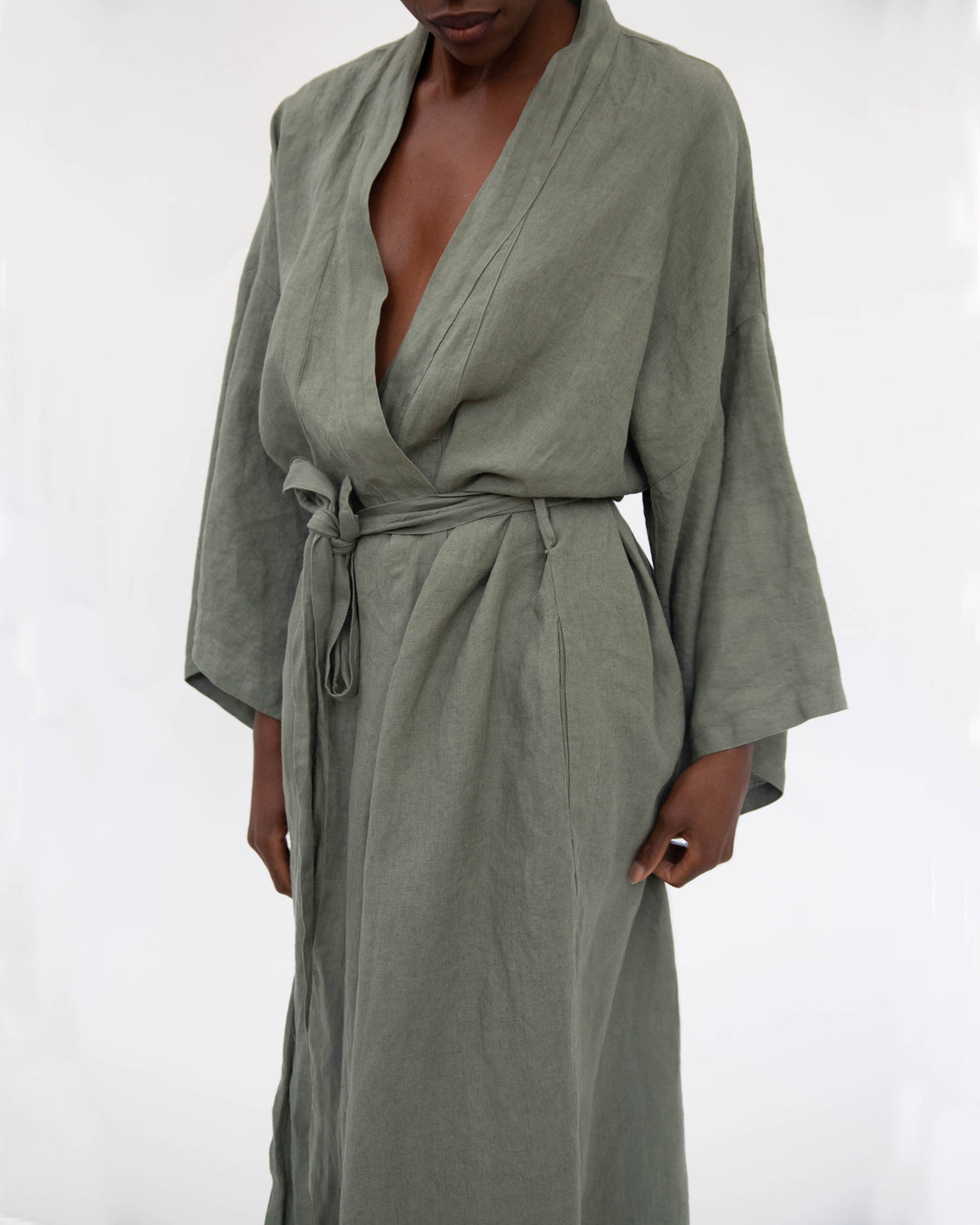 Close-up of lull-length linen robe in Khaki green on model