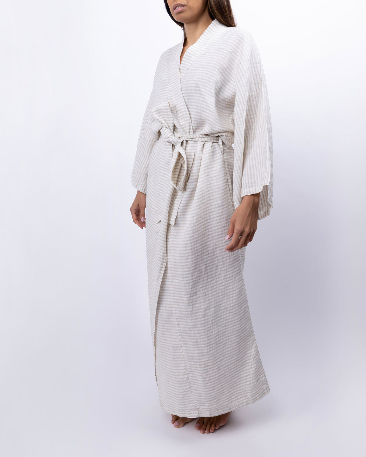 Full-length linen robe in dune colored stripes on model