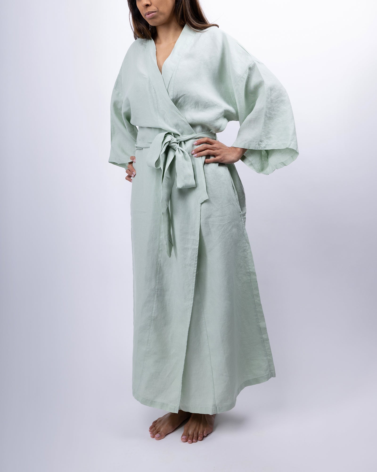 Full-length linen robe in willow green on model