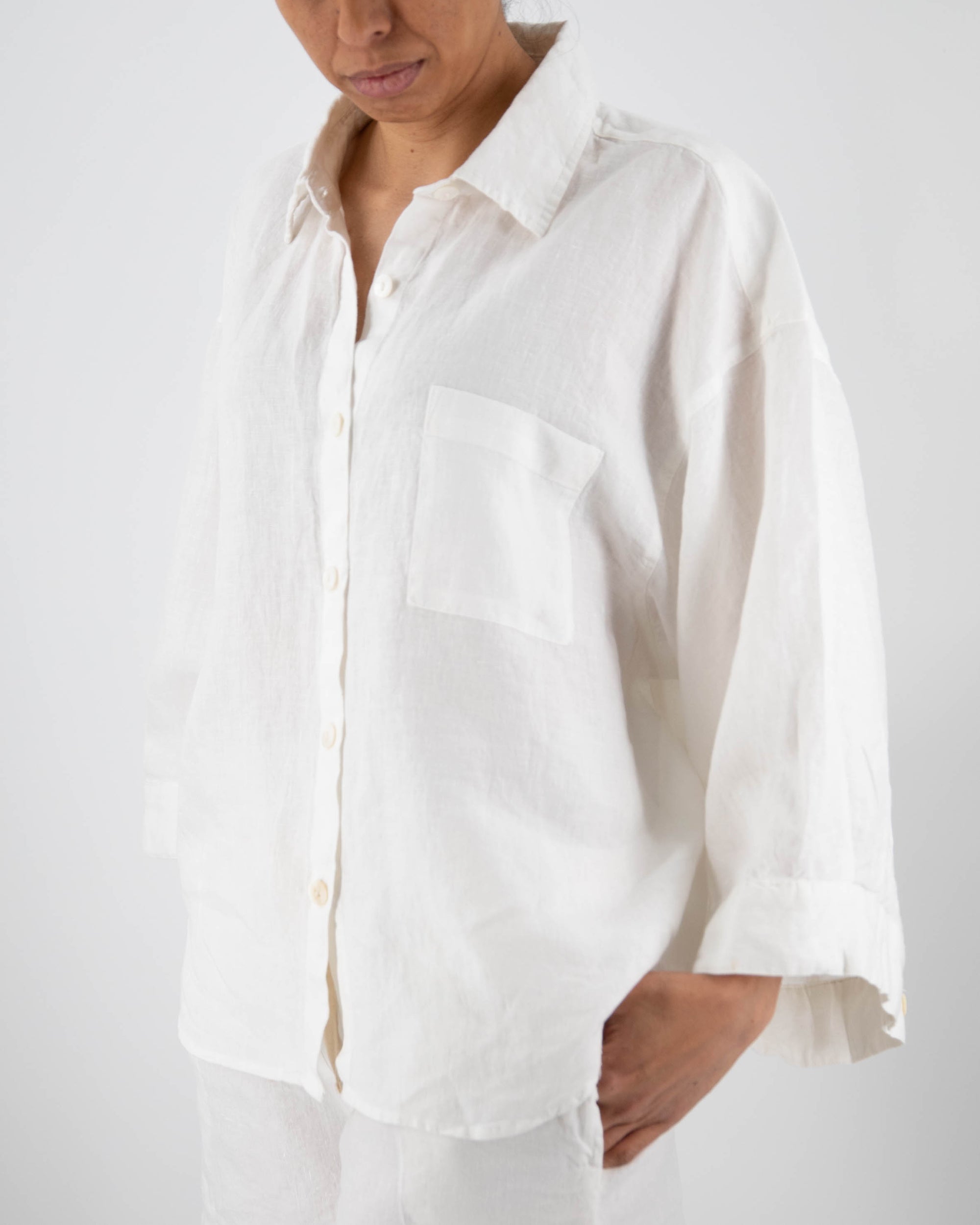 Milk white button down linen shirt on model