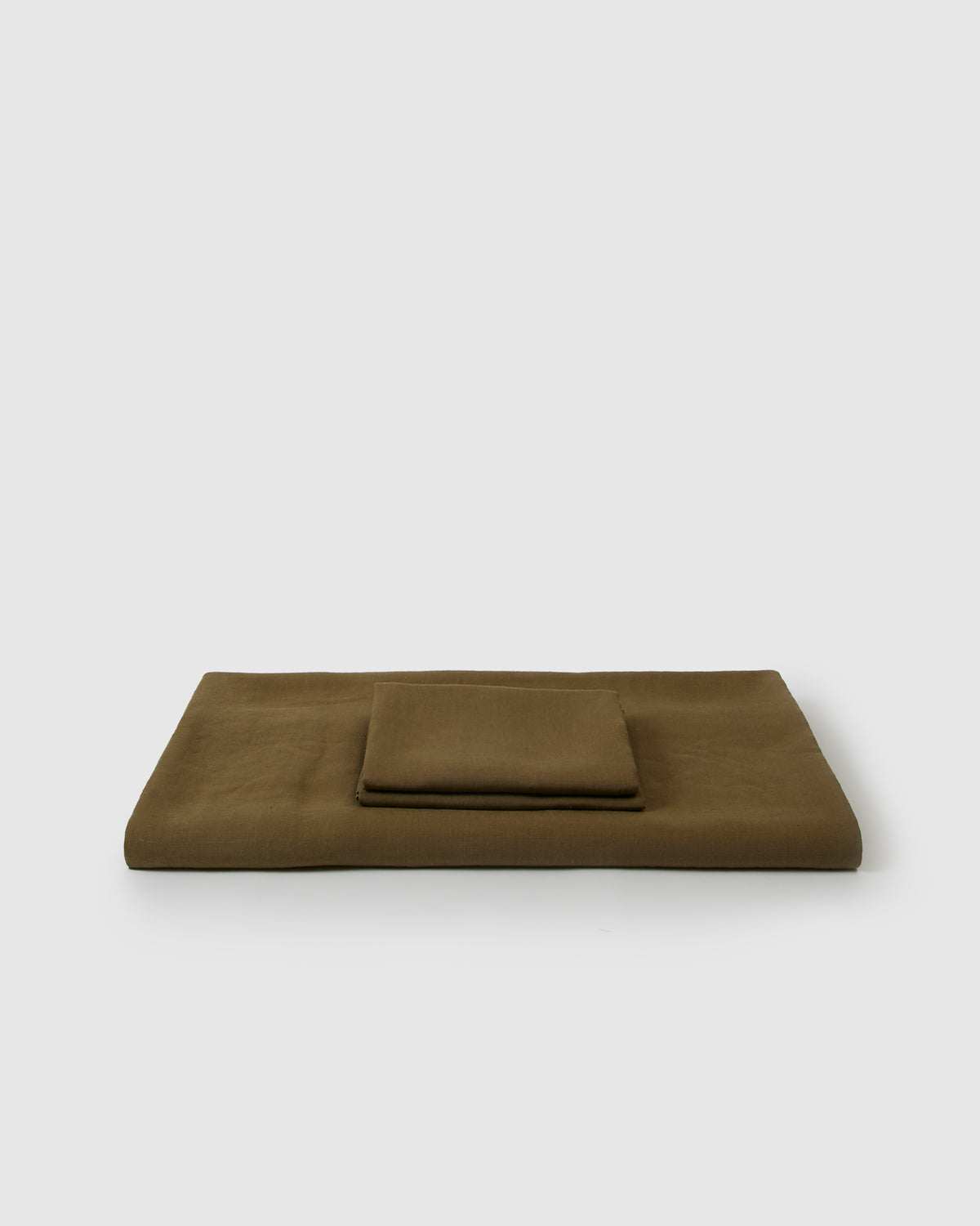 Linen duvet cover and pair of pillowcases in moss green