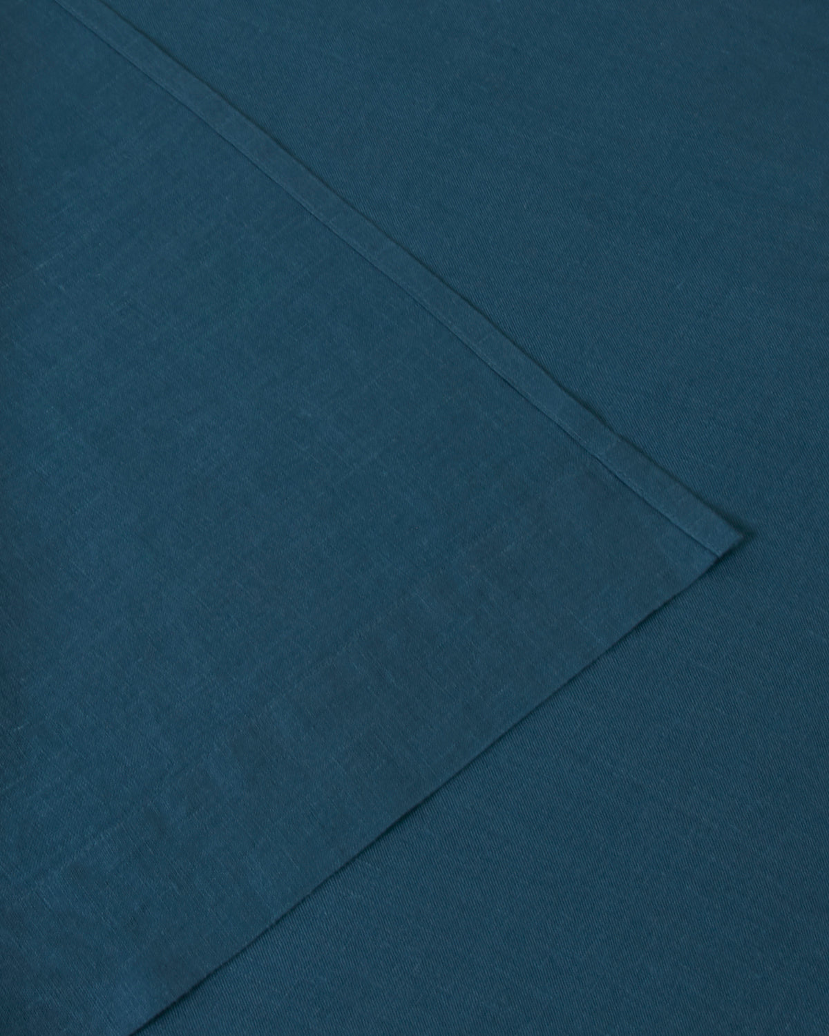 Image of dark adriatic blue flat and fitted sheet set
