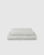 Image of creamy white milk flat and fitted sheet set
