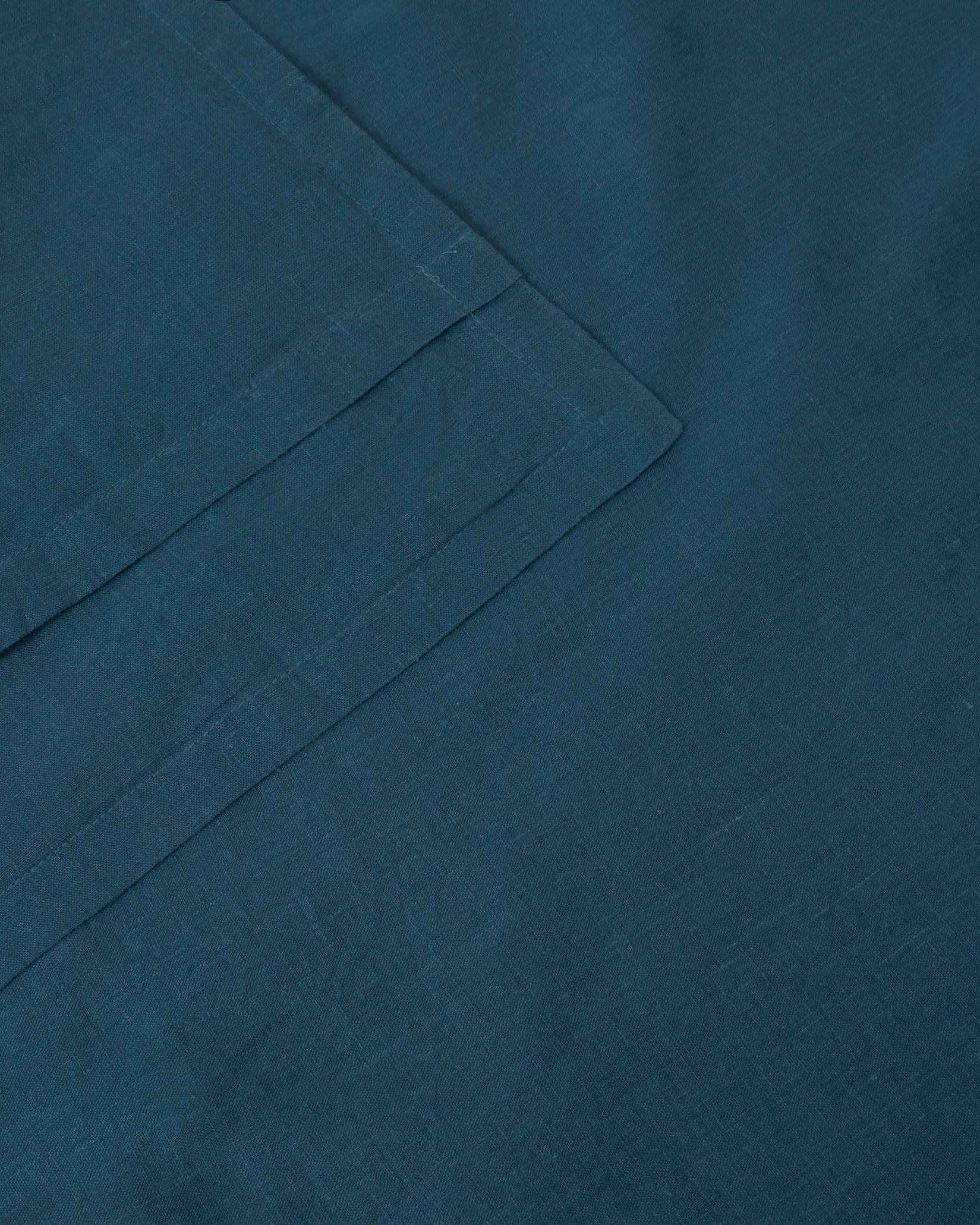 Pair of filled pillowcases in dark blue adriatic