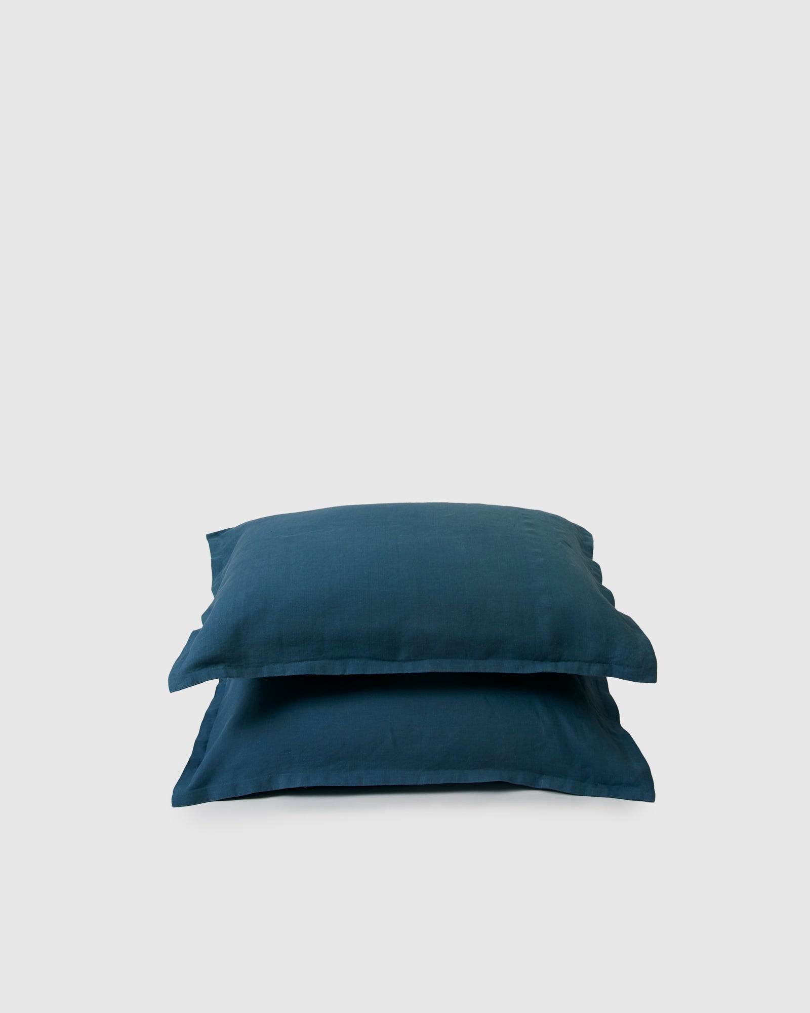 Pair of filled pillowcases in dark blue adriatic