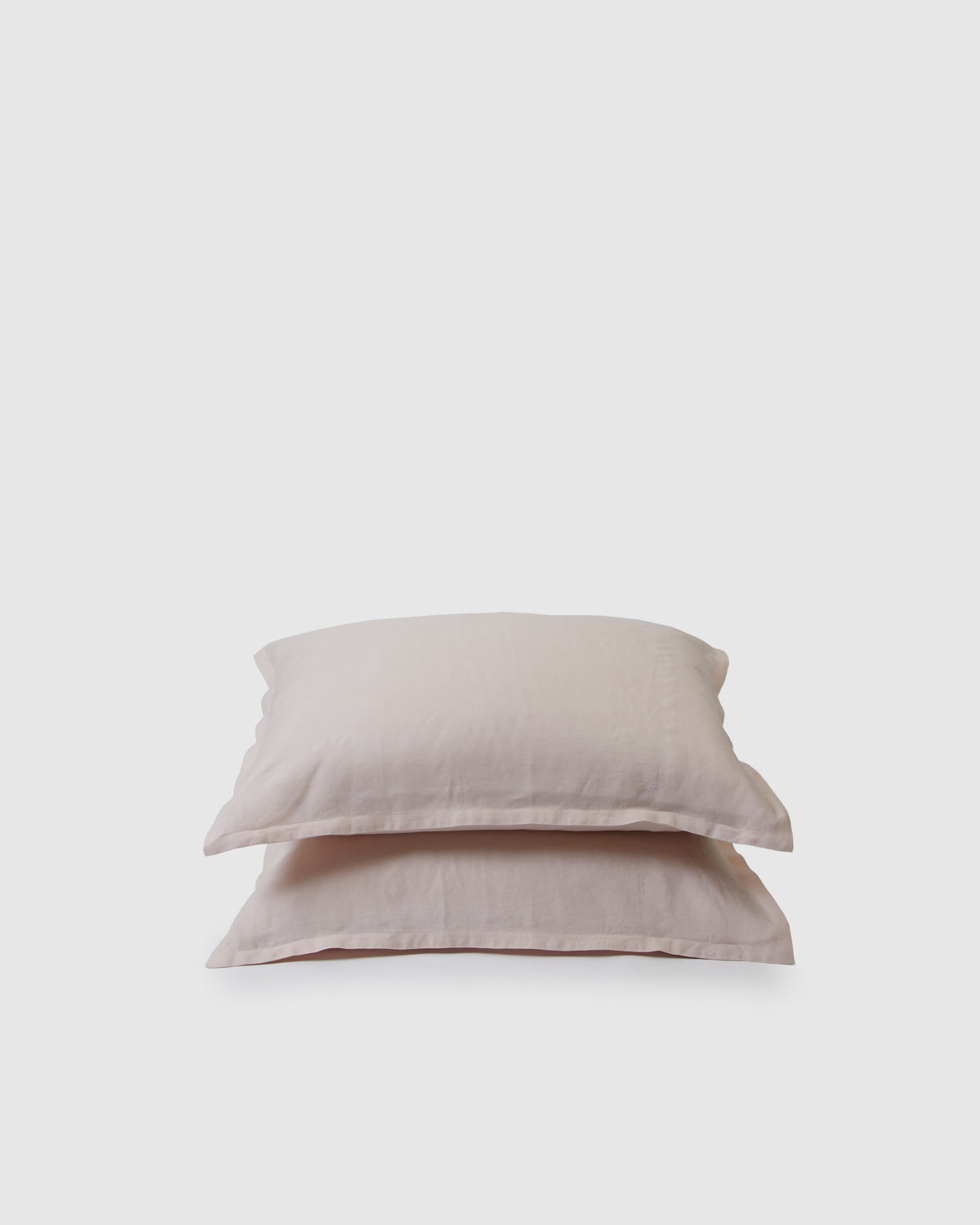 Pair of filled pillowcases in light blush pink