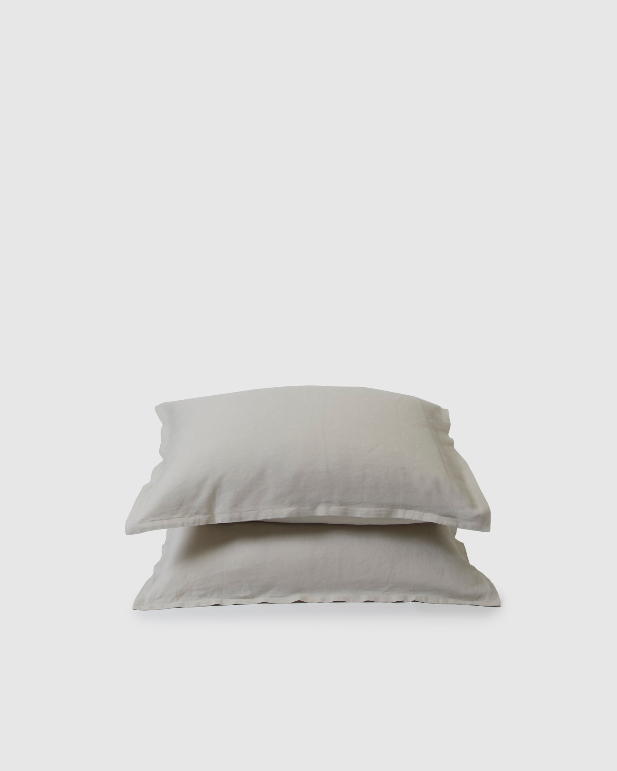 Pair of filled pillowcases in light dove gray