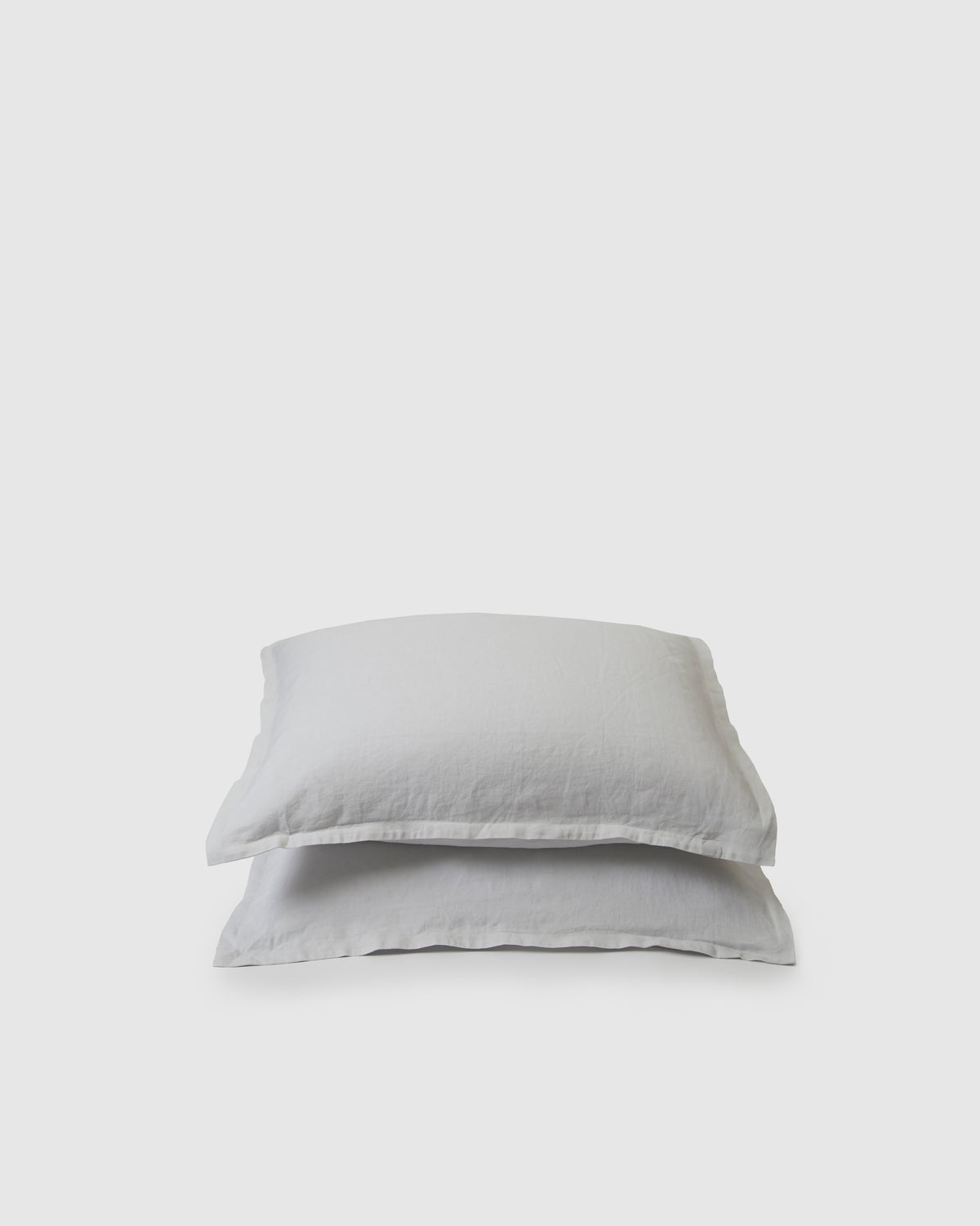 Pair of filled pillowcases in light blue glacier