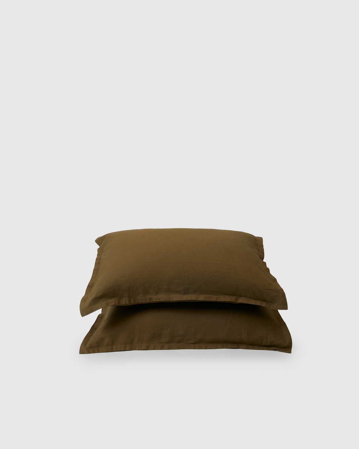 Pair of filled pillowcases in moss green