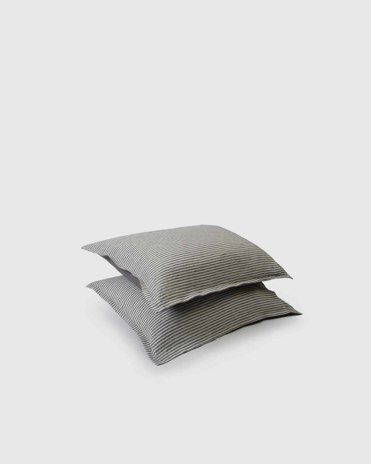 Pair of filled pillowcases in storm stripe dark gray