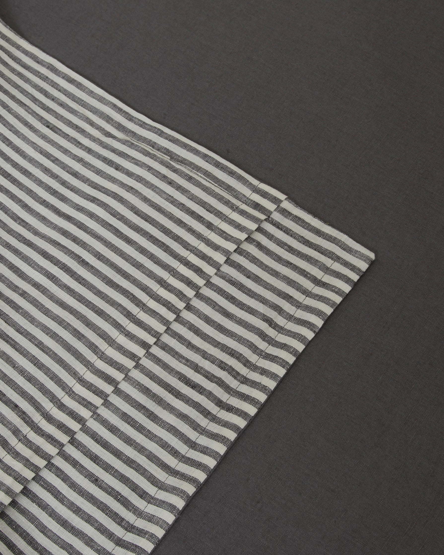 Pair of filled pillowcases in storm and storm stripe dark gray