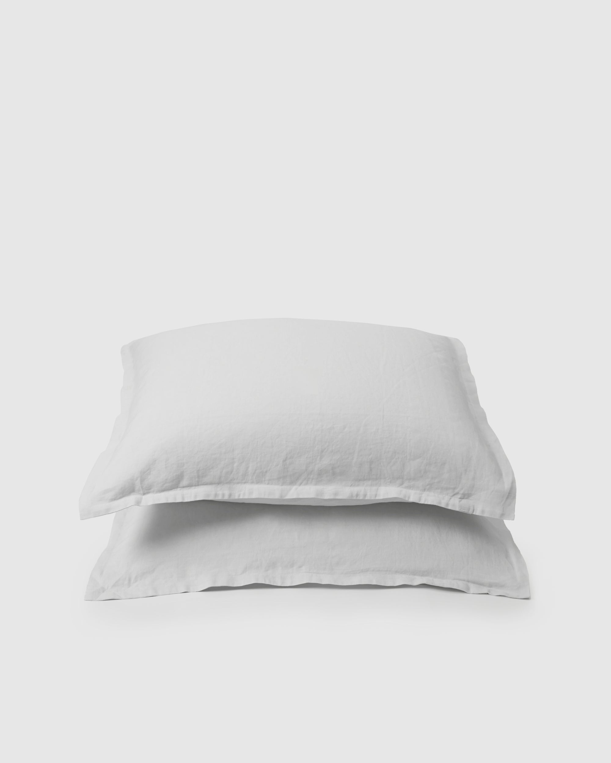 Pair of filled pillowcases in creamy white milk
