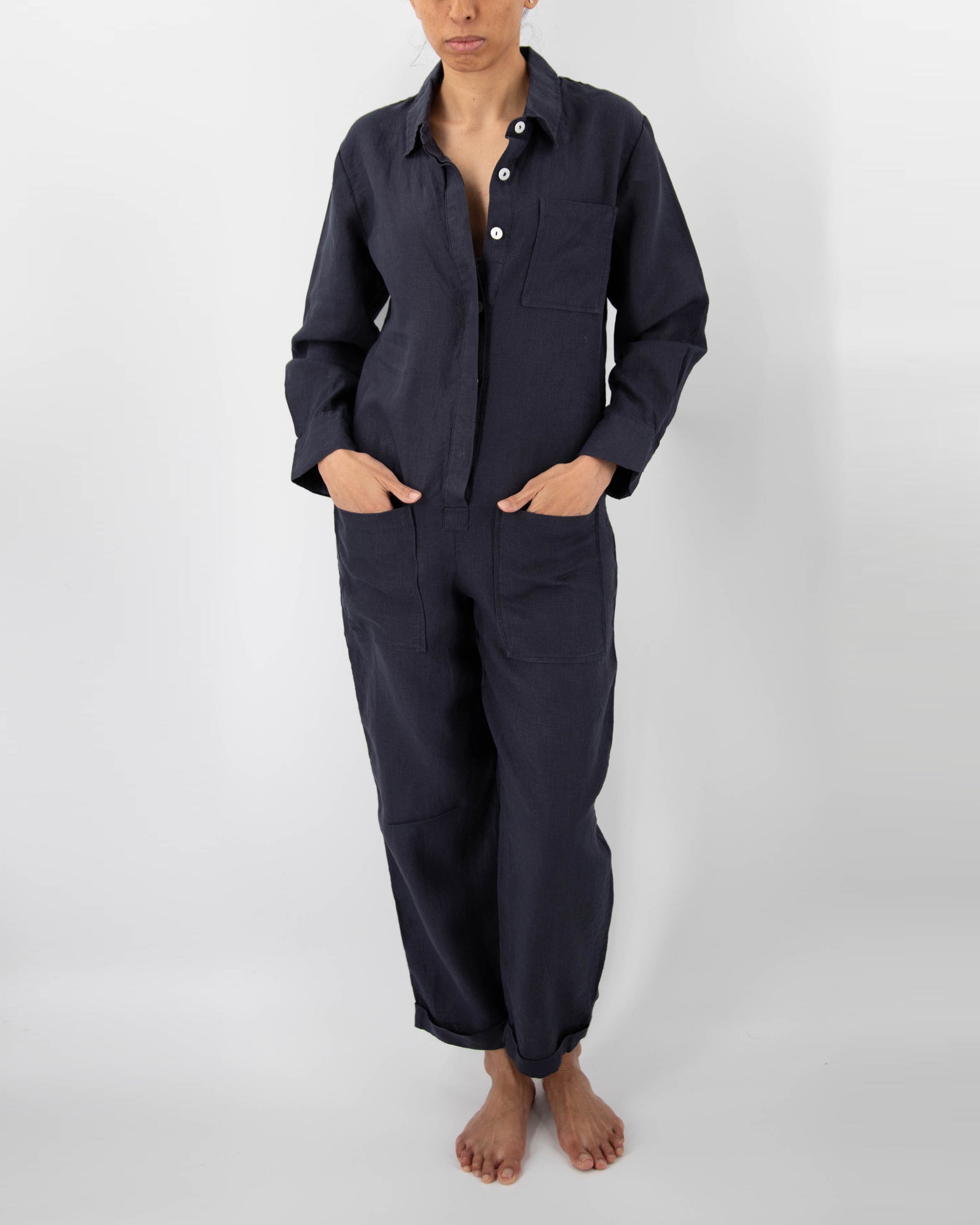 Model in midnight blue linen jumpsuit