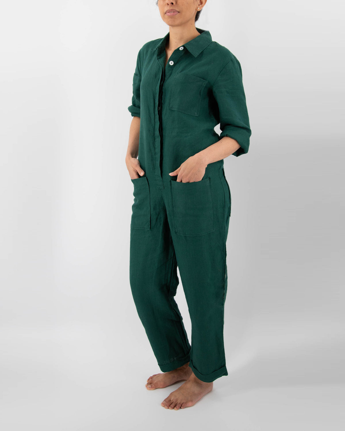 Model in botanical green linen jumpsuit