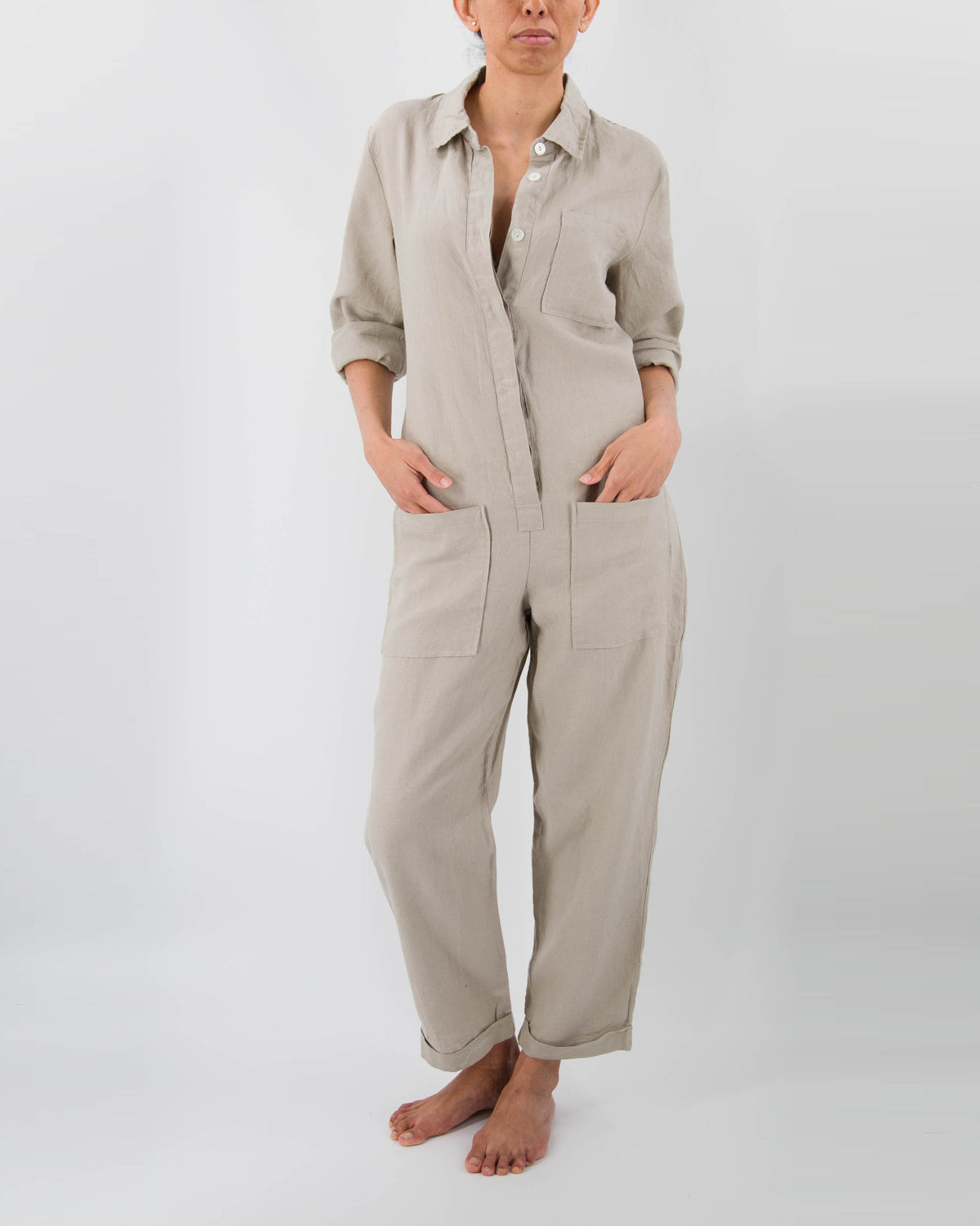 Model in taupe linen jumpsuit