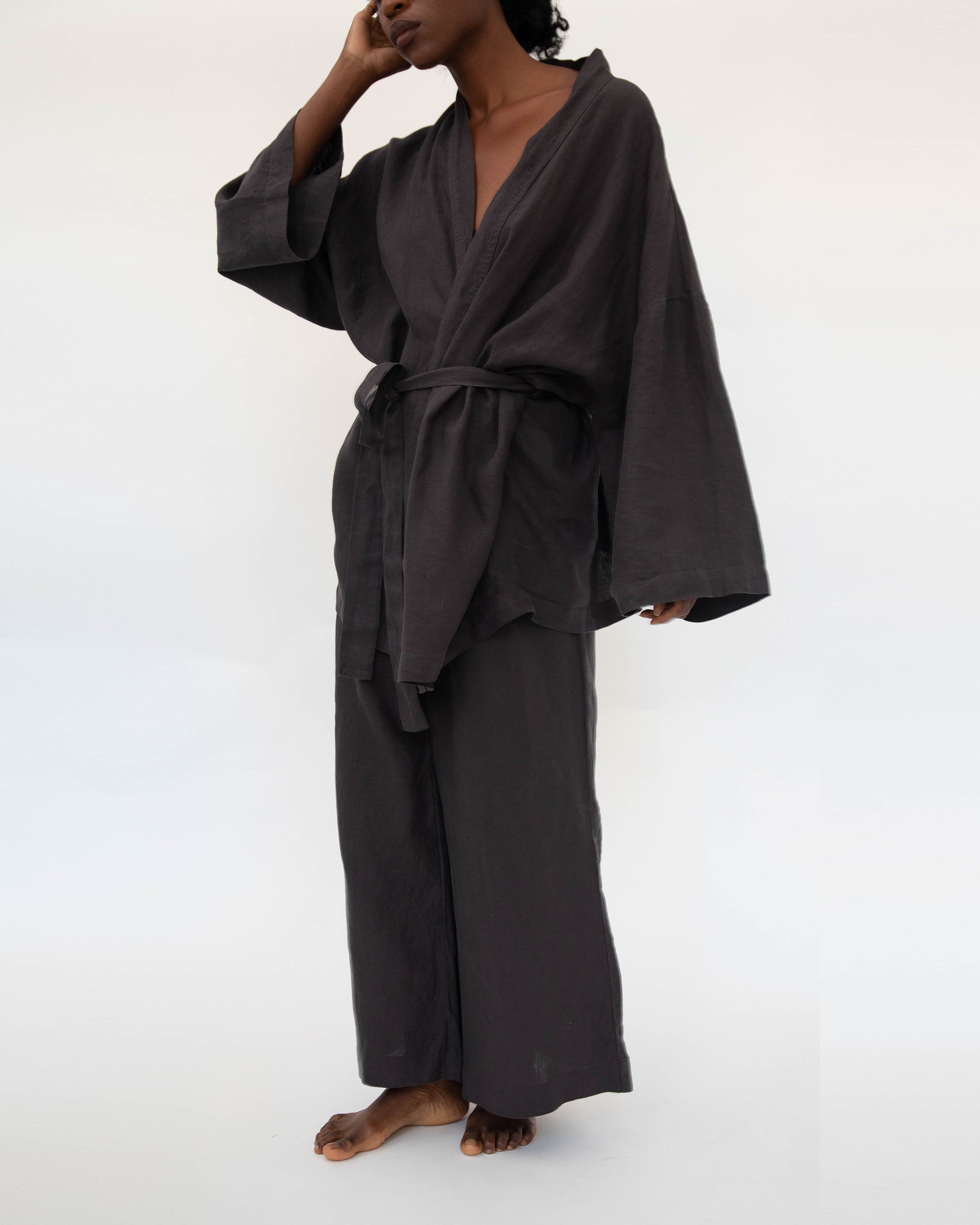 Kimono style loungwear set (top and pants) on model in charcoal black
