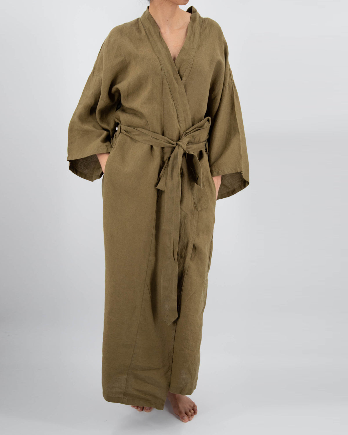 Full-length linen robe in moss green on model